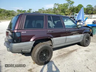 1997 Jeep Grand Cherokee Laredo with VIN 1J4GZ58S5VC688455, listed as a Copart auction lot 74294204 with 135,143 mi miles and Salvage Title. Bid and sale history available at carsss.com. Image 3.
