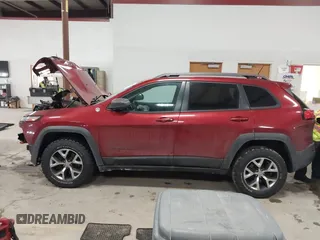 2015 Jeep Cherokee Trailhawk with VIN 1C4PJMBS7FW646577, listed as a IAAI auction lot 41404911 with 85,343 mi miles and . Bid and sale history available at DreamBid. Image 14.