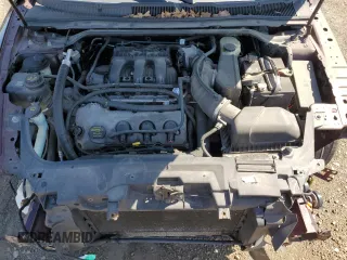 2011 Ford Taurus Limited with VIN 1FAHP2FW6BG142472, listed as a Copart auction lot 58534985 with 154,984 mi miles and Salvage title. Bid and sale history available at DreamBid. Image 11.