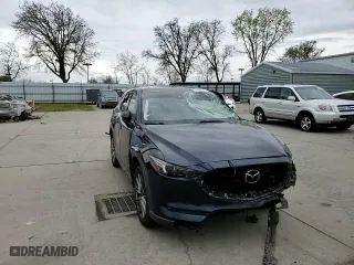 2021 Mazda CX-5 Grand Touring with VIN JM3KFADM8M1321415, listed as a Copart auction lot 47685415 with 90,145 mi miles and Salvage Title. Bid and sale history available at carsss.com. Image 12.