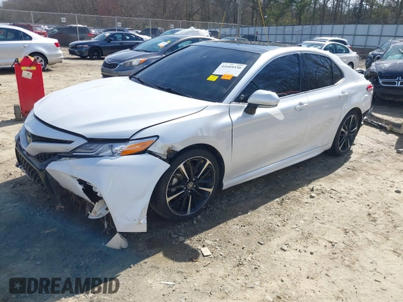 2020 Toyota Camry XSE with VIN 4T1K61AK8LU987937, listed as a IAAI auction lot 41604530 with 102,967 mi miles and . Bid and sale history available at DreamBid. Image 2.