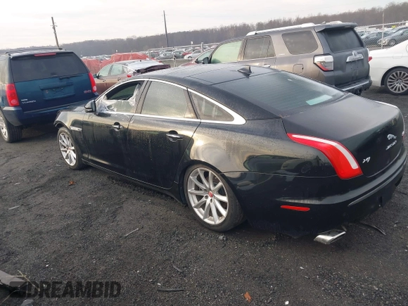 2014 Jaguar XJ with VIN SAJWA1CZXE8V74400, listed as a IAAI auction lot 38250698 with 102,205 mi miles and . Bid and sale history available at DreamBid. Image 3.