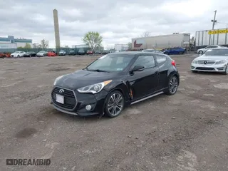 2016 Hyundai Veloster Turbo with VIN KMHTC6AE1GU264151, listed as a IAAI auction lot 42054383 with 92,378 mi miles. Bid and sale history available at carsss.com. Image 2.