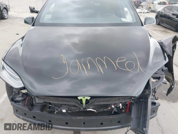 2017 Tesla Model X 90D with VIN 5YJXCAE2XHF075341, listed as a IAAI auction lot 41784008 with 77,439 mi miles and . Bid and sale history available at DreamBid. Image 10.