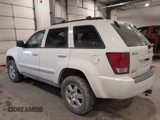 2010 Jeep Grand Cherokee Laredo with VIN 1J4PR4GK7AC126059, listed as a IAAI auction lot 41599058 with 154,192 mi miles. Bid and sale history available at carsss.com. Image 3.