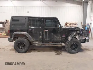 2017 Jeep Wrangler Unlimited Sport with VIN 1C4BJWDGXHL698014, listed as a IAAI auction lot 41384325 with 121,402 mi miles. Bid and sale history available at carsss.com. Image 14.