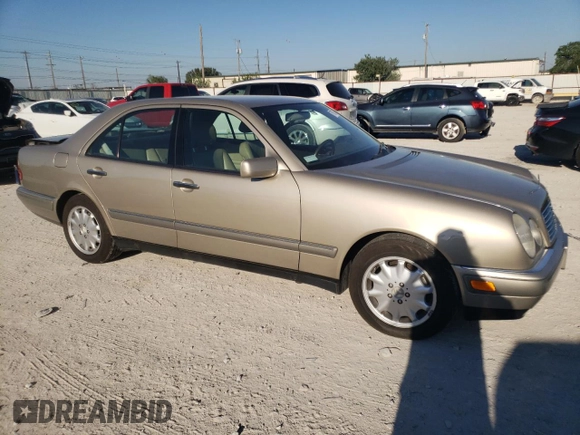 1996 Mercedes-Benz E-Class with VIN WDBJF55F7TJ022765, listed as a Copart auction lot 70577504 with 186,340 mi miles and Salvage Title. Bid and sale history available at carsss.com. Image 4.