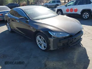 2013 Tesla Model S with VIN 5YJSA1DN4DFP19552, listed as a IAAI auction lot 41360466 with 129,806 mi miles. Bid and sale history available at carsss.com. Image 1.