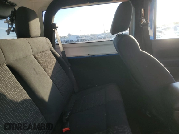 2011 Jeep Wrangler Sahara with VIN 1J4GA5D15BL632709, listed as a Copart auction lot 84118104 with 87,644 mi miles and Salvage Title. Bid and sale history available at DreamBid. Image 11.