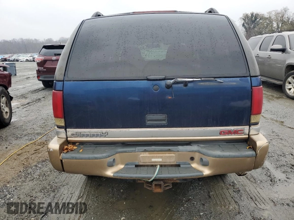 1999 GMC Jimmy SLE z VIN 1GKDT13W8X2545509, wystawiony jako Copart lot #81608944 z przebiegiem 130 881 mil mil oraz Szkoda całkowita • Salvage title. Historia ofert i sprzedaży dostępna na DreamBid. Obrazek 6.