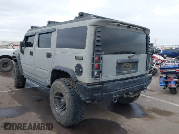2003 Hummer H2 with VIN 5GRGN23U13H128617, listed as a IAAI auction lot 41494349 with 135,295 mi miles. Bid and sale history available at carsss.com. Image 3.