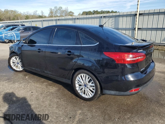 2016 Ford Focus Titanium with VIN 1FADP3J22GL201721, listed as a Copart auction lot 50633795 with 29,801 mi miles and Salvage title. Bid and sale history available at DreamBid. Image 2.