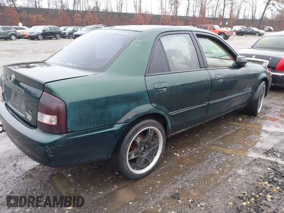 2000 Mazda Protege DX with VIN JM1BJ2225Y0255349, listed as a IAAI auction lot 41604895 with Not Provided miles and . Bid and sale history available at DreamBid. Image 4.