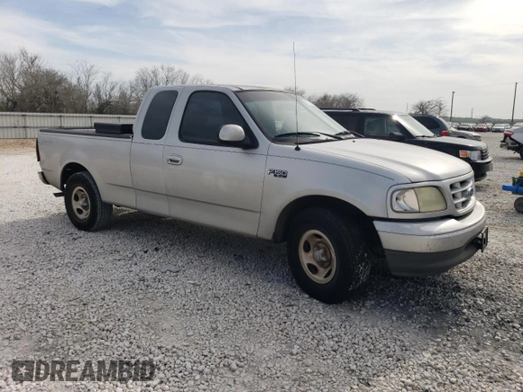 2002 Ford F-150 XL with VIN 1FTRX17282NA63790, listed as a Copart auction lot 42057394 with 158,054 mi miles and Salvage Title. Bid and sale history available at carsss.com. Image 4.
