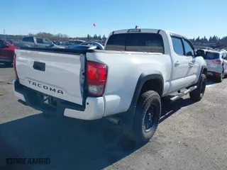 2017 Toyota Tacoma SR5 with VIN 3TMDZ5BN3HM023813, listed as a IAAI auction lot 41522828 with 128,533 mi miles. Bid and sale history available at carsss.com. Image 4.