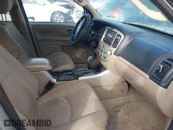 2006 Mazda Tribute LX with VIN 4F2YZ94126KM09467, listed as a IAAI auction lot 41324941 with 116,519 mi miles and . Bid and sale history available at DreamBid. Image 5.