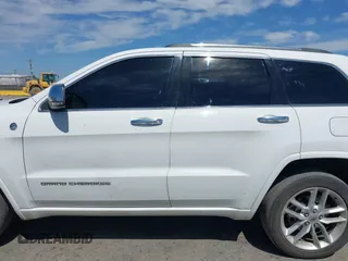 2015 Jeep Grand Cherokee Overland with VIN 1C4RJFCG3FC230185, listed as a IAAI auction lot 42494650 with 123,128 mi miles and . Bid and sale history available at DreamBid. Image 14.