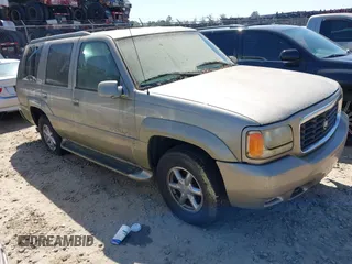 2000 Cadillac Escalade z VIN 1GYEK63R2YR209125, wystawiony jako IAAI lot #41854270 z przebiegiem 198 017 mil mil oraz . Historia ofert i sprzedaży dostępna na DreamBid. Obrazek 1.