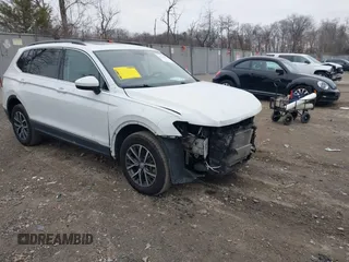 2020 Volkswagen Tiguan SE with VIN 3VV2B7AX0LM075033, listed as a IAAI auction lot 41310056 with 82,548 mi miles and . Bid and sale history available at DreamBid. Image 1.