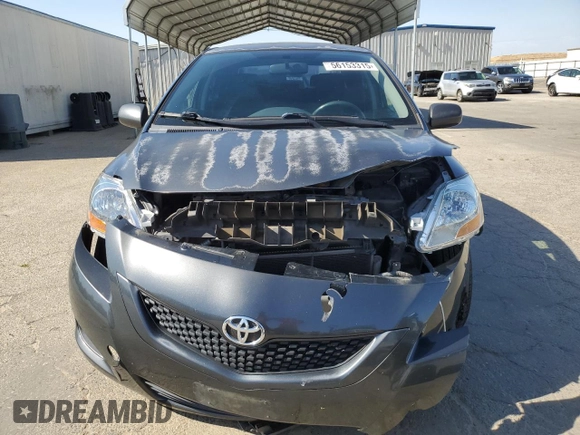 2009 Toyota Yaris z VIN JTDBT903891317448, wystawiony jako Copart lot #56153315 z przebiegiem 209 441 mil mil oraz Szkoda całkowita • Salvage title. Historia ofert i sprzedaży dostępna na DreamBid. Obrazek 5.