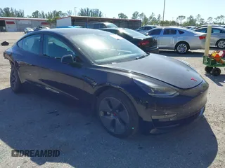 2023 Tesla Model 3 with VIN 5YJ3E1EAXPF623403, listed as a IAAI auction lot 41829543 with 29,414 mi miles. Bid and sale history available at carsss.com. Image 1.