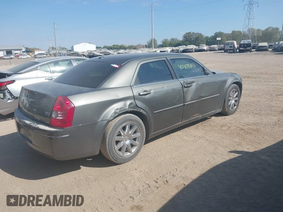 2009 Chrysler 300 Touring with VIN 2C3LA53V09H520923, listed as a IAAI auction lot 40408803 with 216,747 mi miles. Bid and sale history available at carsss.com. Image 4.