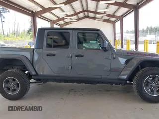 2022 Jeep Gladiator Rubicon with VIN 1C6JJTBG6NL166081, listed as a IAAI auction lot 42204431 with 40,568 mi miles and . Bid and sale history available at DreamBid. Image 14.