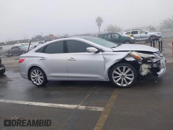 2014 Hyundai Azera Limited with VIN KMHFH4JG7EA388931, listed as a IAAI auction lot 41468407 with 130,597 mi miles and . Bid and sale history available at DreamBid. Image 13.