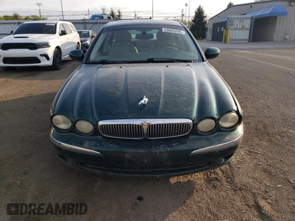 2004 Jaguar X-Type z VIN SAJEA51C04WD65097, wystawiony jako Copart lot #53825295 z przebiegiem 58 270 mil mil oraz Szkoda całkowita • Salvage title. Historia ofert i sprzedaży dostępna na DreamBid. Obrazek 5.