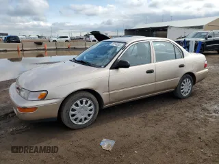1997 Toyota Corolla with VIN 1NXBA02E4VZ599205, listed as a Copart auction lot 59149585 with 107,354 mi miles and Salvage title. Bid and sale history available at DreamBid. Image 1.