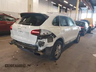 2016 Porsche Cayenne with VIN WP1AA2A26GLA10357, listed as a IAAI auction lot 41370956 with 96,026 mi miles. Bid and sale history available at carsss.com. Image 4.
