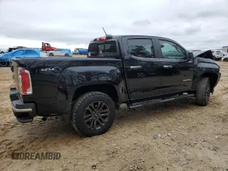 2020 GMC Canyon 4WD SLT with VIN 1GTG6DEN4L1130421, listed as a Copart auction lot 49883405 with 49,142 mi miles and Salvage Title. Bid and sale history available at carsss.com. Image 3.