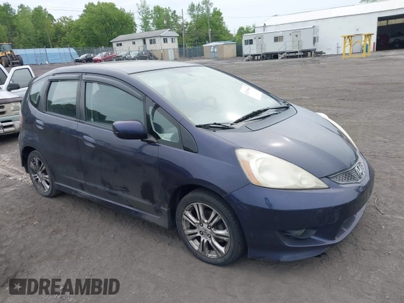 2009 Honda Fit Sport z VIN JHMGE87679S043551, wystawiony jako IAAI lot #42353546 z przebiegiem 156 143 mil mil oraz . Historia ofert i sprzedaży dostępna na DreamBid. Obrazek 1.