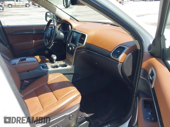 2015 Jeep Grand Cherokee Summit with VIN 1C4RJFJG1FC797711, listed as a IAAI auction lot 42026431 with 101,075 mi miles and . Bid and sale history available at DreamBid. Image 5.