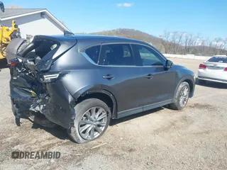 2020 Mazda CX-5 Grand Touring with VIN JM3KFBDM1L0821975, listed as a IAAI auction lot 40088794 with 68,895 mi miles and . Bid and sale history available at DreamBid. Image 4.