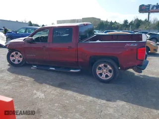 2016 Chevrolet Silverado 1500 LT with VIN 3GCUKREC0GG354271, listed as a IAAI auction lot 38948207 with 130,369 mi miles. Bid and sale history available at carsss.com. Image 14.