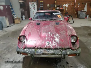 1981 Datsun 280ZX z VIN JN1HZ04S1BX414616, wystawiony jako Copart lot #82249204 z przebiegiem 114 028 mil mil oraz Tytuł czysty. Historia ofert i sprzedaży dostępna na DreamBid. Obrazek 5.