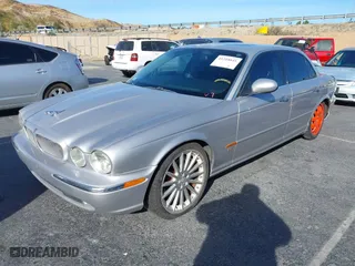 2004 Jaguar XJ with VIN SAJWA73B94TG30153, listed as a IAAI auction lot 41218841 with 91,158 mi miles. Bid and sale history available at carsss.com. Image 2.
