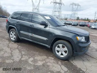 2011 Jeep Grand Cherokee Laredo with VIN 1J4RR4GG7BC721483, listed as a IAAI auction lot 41810180 with 181,558 mi miles. Bid and sale history available at carsss.com. Image 1.