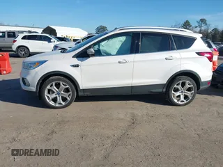 2019 Ford Escape Titanium with VIN 1FMCU9J91KUB21842, listed as a IAAI auction lot 41632210 with 104,900 mi miles. Bid and sale history available at carsss.com. Image 14.