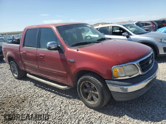 2001 Ford F-150 XLT with VIN 1FTRW07W71KE22482, listed as a Copart auction lot 62546815 with 218,501 mi miles and Clean title. Bid and sale history available at DreamBid. Image 4.