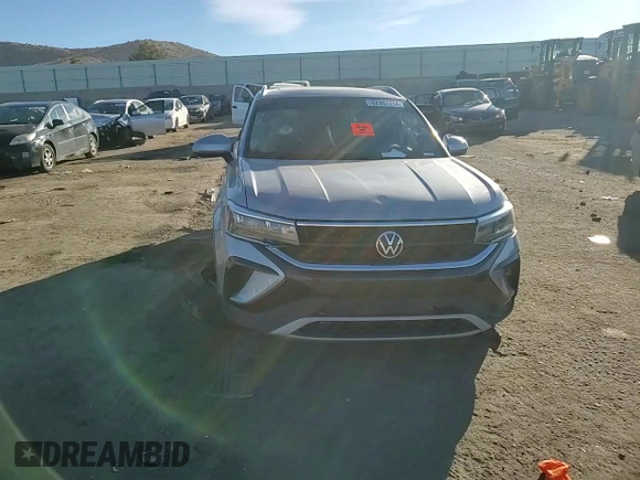 2023 Volkswagen Taos SE z VIN 3VVNX7B21PM308277, wystawiony jako Copart lot #82367714 z przebiegiem Nie podano mil oraz Nie do naprawy • Non repairable. Historia ofert i sprzedaży dostępna na DreamBid. Obrazek 11.