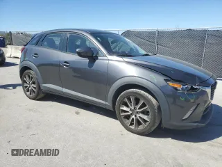 2017 Mazda CX-3 Touring z VIN JM1DKDC73H0172403, wystawiony jako Copart lot #47396355 z przebiegiem 79 865 mil mil oraz Szkoda całkowita • Salvage title. Historia ofert i sprzedaży dostępna na DreamBid. Obrazek 4.