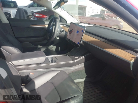 2023 Tesla Model 3 with VIN 5YJ3E1EA9PF546264, listed as a IAAI auction lot 41657055 with 5,634 mi miles and . Bid and sale history available at DreamBid. Image 5.