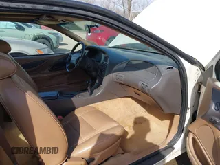 1996 Ford Thunderbird LX z VIN 1FALP6240TH131517, wystawiony jako IAAI lot #41811552 z przebiegiem 87 493 mil mil oraz . Historia ofert i sprzedaży dostępna na DreamBid. Obrazek 5.