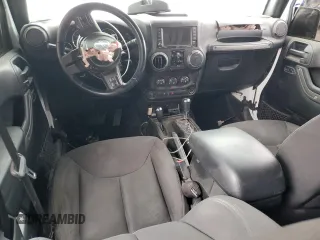 2018 Jeep Wrangler Unlimited Sport S with VIN 1C4BJWDG9JL887033, listed as a Copart auction lot 61785565 with 66,725 mi miles and Salvage title. Bid and sale history available at DreamBid. Image 8.
