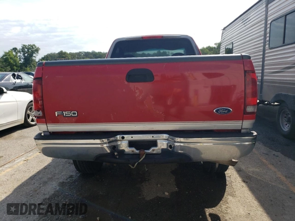 1998 Ford F-150 with VIN 1FTZF1821WKA63445, listed as a Copart auction lot 62563374 with 270,311 mi miles and Salvage title. Bid and sale history available at DreamBid. Image 6.