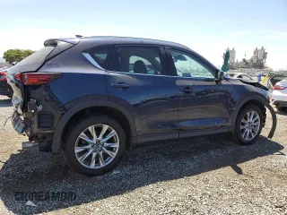 2020 Mazda CX-5 Grand Touring z VIN JM3KFADM4L0794765, wystawiony jako Copart lot #63850005 z przebiegiem 53 270 mil mil oraz Szkoda całkowita • Salvage title. Historia ofert i sprzedaży dostępna na DreamBid. Obrazek 3.