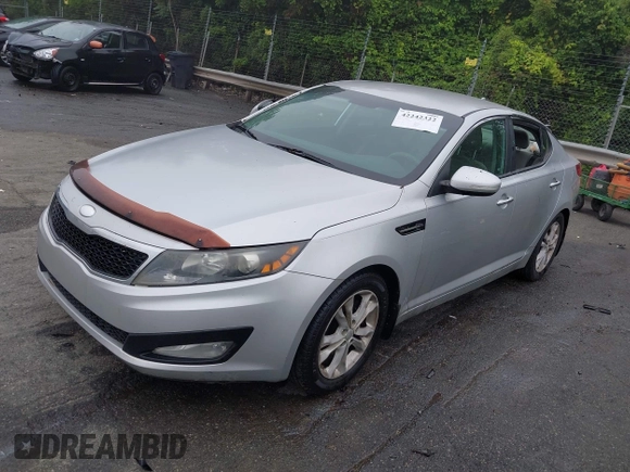 2013 Kia Optima LX z VIN 5XXGM4A76DG226683, wystawiony jako IAAI lot #42242322 z przebiegiem 194 059 mil mil oraz . Historia ofert i sprzedaży dostępna na DreamBid. Obrazek 2.