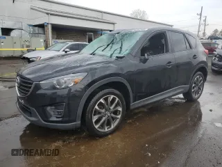 2016 Mazda CX-5 Grand Touring with VIN JM3KE4DYXG0711367, listed as a Copart auction lot 52862405 with 87,870 mi miles and Salvage Title. Bid and sale history available at DreamBid. Image 1.